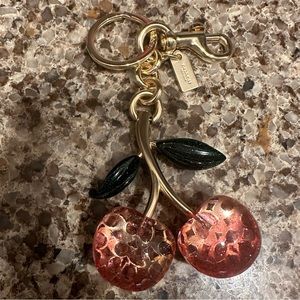 Coach Signature cherry bay charm